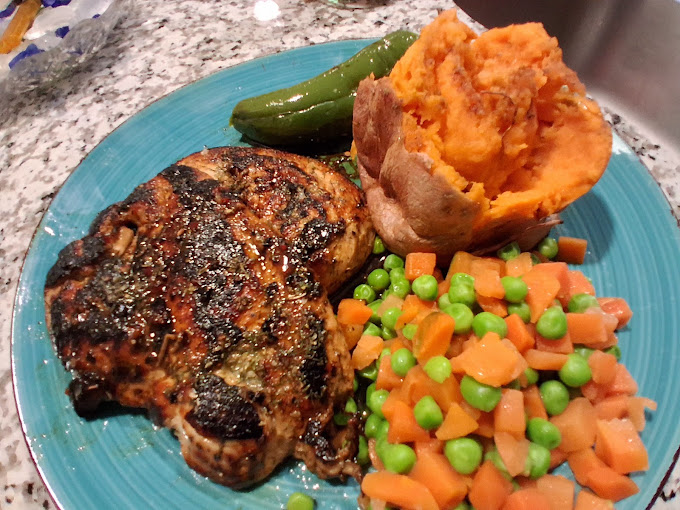 Grilled steak with vegetables and baked potato